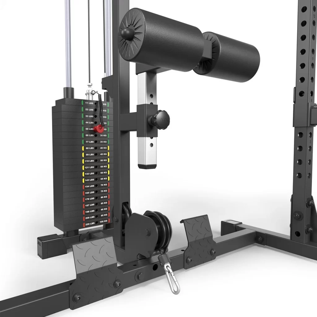 Close-up of a gym machine featuring a weight stack with color-coded labels, pulley system, and padded rollers. The setup is part of a larger exercise equipment structure, designed for lower body workouts.