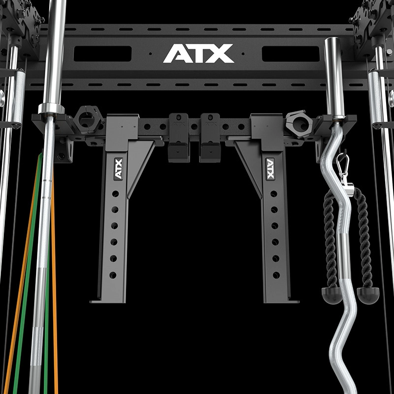 Close-up of the ATX Half Rack with Cable Crossover, shown with attached resistance bands, a wavy barbell, and a rope handle set against a black background.