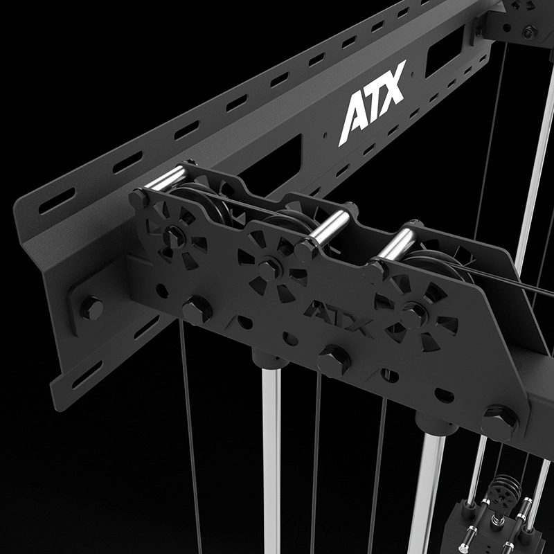 Close-up of the ATX Half Rack with Cable Crossover, showing its black metal frame, multiple bolts, pulleys, and cables set against a black background.