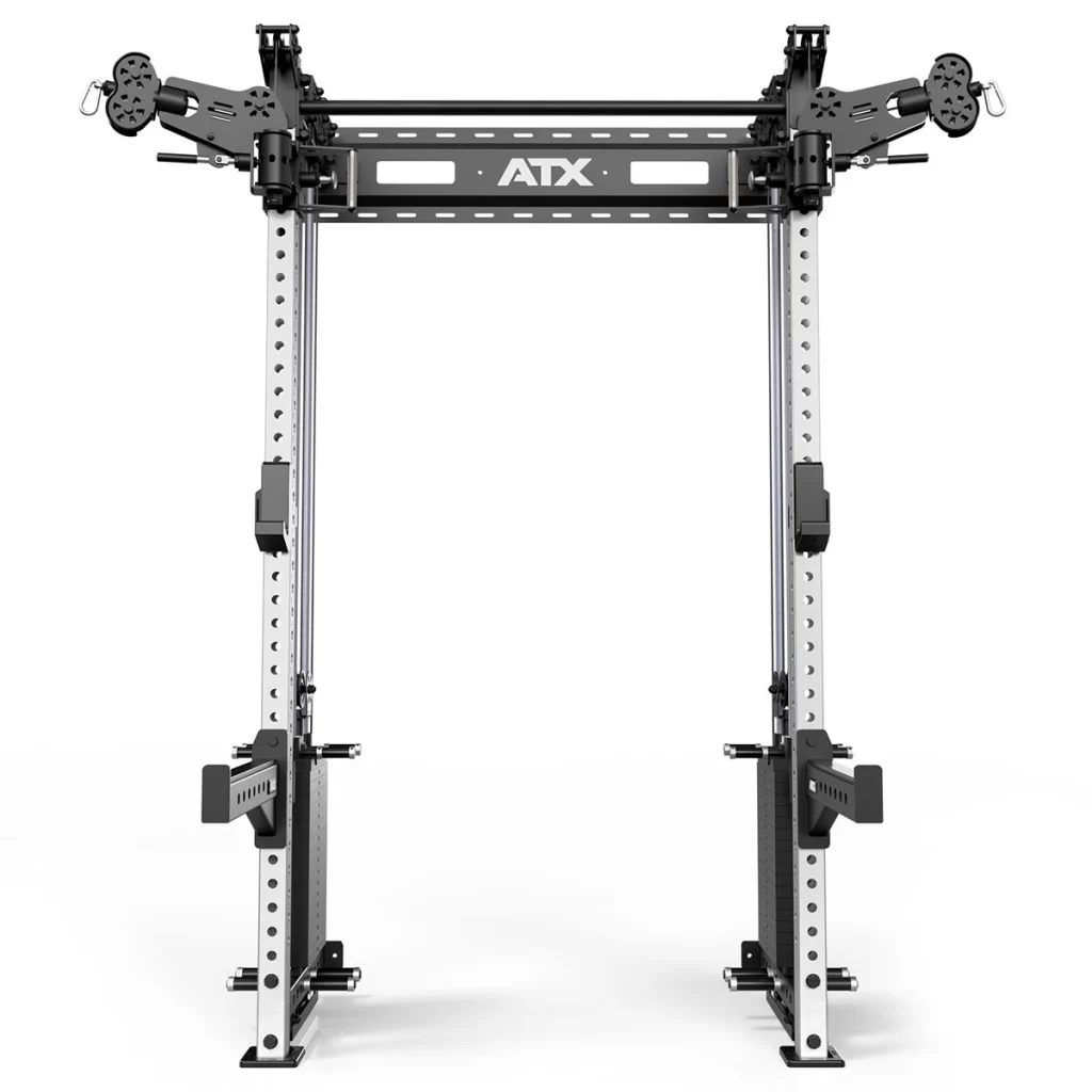A black and silver power rack with adjustable safety bars and various attachment points, labeled ATX at the top. It’s designed for weightlifting and strength training exercises.