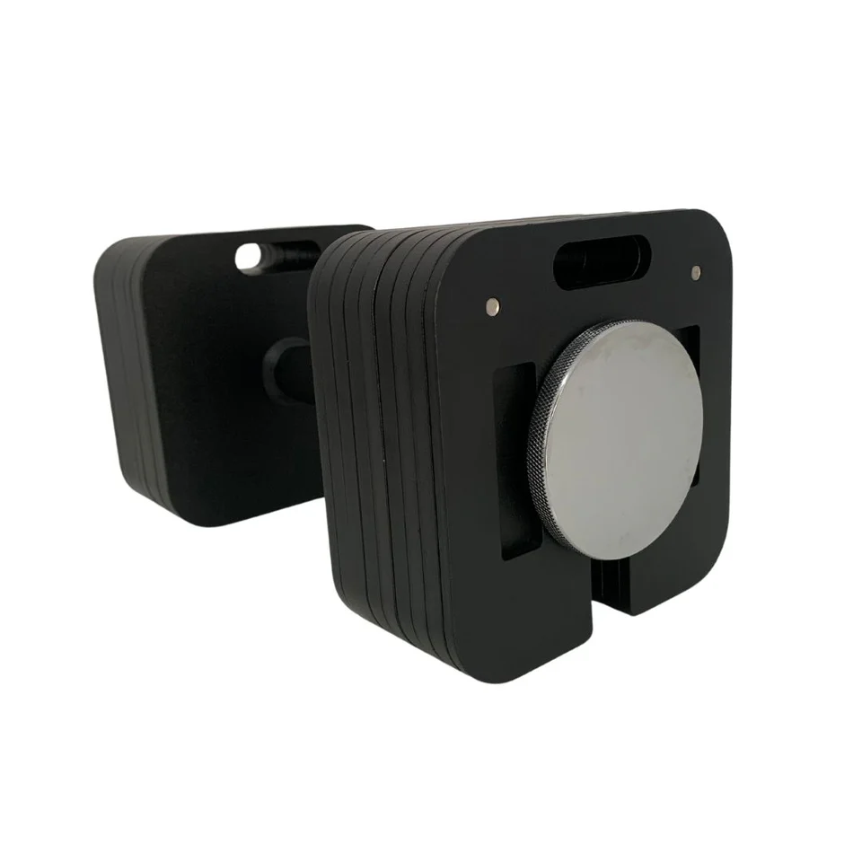 A pair of adjustable magnet-style camera weights with a black exterior and metallic knobs. Designed for stability, they are compact and feature multiple layers with holes for mounting.