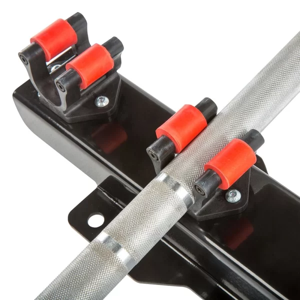 Close-up of a heavy-duty metal clamp with a textured tube secured by red and black roller grips. The clamp is mounted on a black base with visible bolts for fastening. Suitable for industrial or mechanical applications.