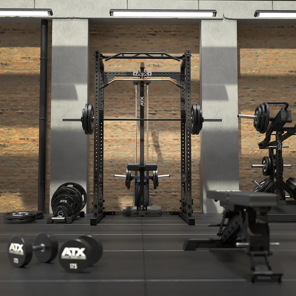 A 640 Low Ceiling + Plate Load Lat Option squat rack with a plate-loaded lat pulldown attachment, surrounded by a weight bench, dumbbells, and weight plates in a gym setting.