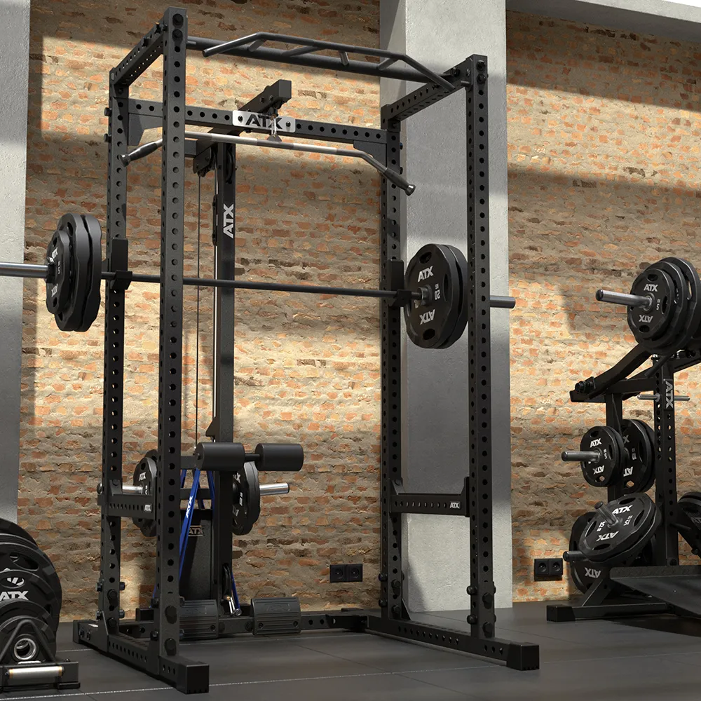 Black 640 Low Ceiling + Plate Load Lat Option power rack with a lat pulldown attachment, a barbell loaded with weight plates, and a pull-up bar.