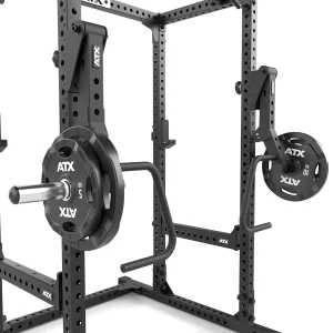 The ATX® Jammer Arms B4 are attachable arms for black steel squat racks, set at different heights on the vertical posts, with multiple adjustment holes for custom setups; weight plates are labeled “ATX.”.