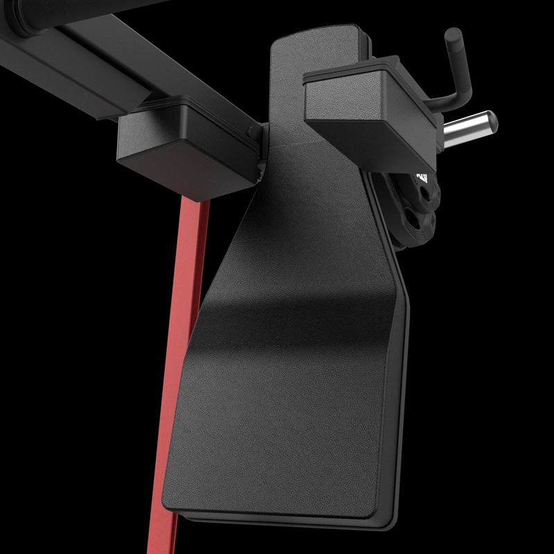 Close-up of the ATX® Pendulum Squat Machine in black and red, featuring padded surfaces and metal handles for fitness or weight training, shown against a plain black background.
