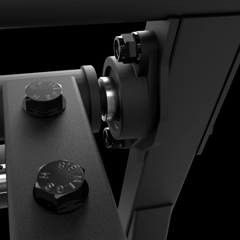 Close-up of an ATX® Pendulum Squat Machine component with large bolts, a cylindrical bearing, and industrial fittings, shown against a black background.