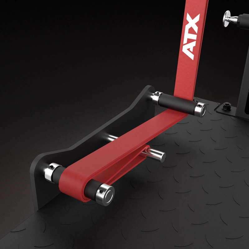 Close-up of the ATX® Pendulum Squat Machine attachment with padded handles and ATX logo on the red bar, set on a textured black platform.