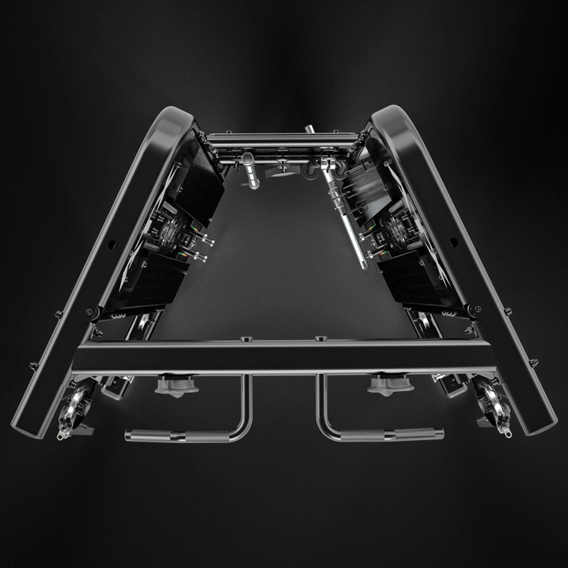 A symmetrical, metallic device with black panels and exposed components, viewed from the front against a dark background, resembling advanced fitness or mechanical equipment.