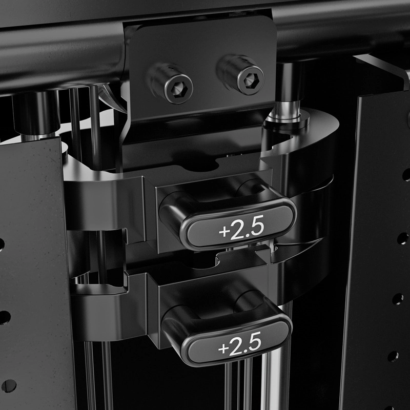 Close-up view of two metallic adjustment levers labeled +2.5 on a black fitness machine, with bolts and cylindrical rods visible in the background.