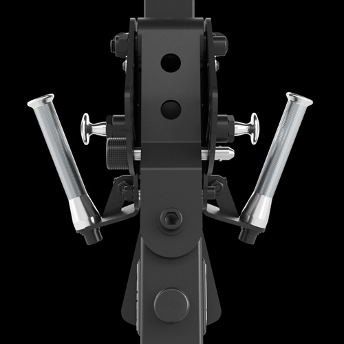 Close-up, front-facing view of a black exercise machine part with two silver, textured handles angled outward against a solid black background.