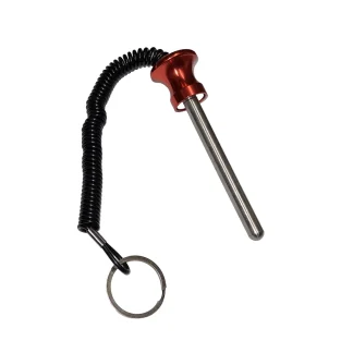 A metal pin with a red anodized handle, attached to a black coiled lanyard and a key ring.