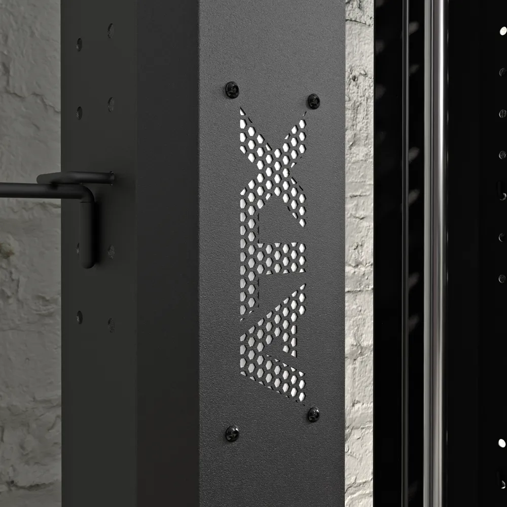 Close-up of a black metal fitness rack with perforated XIV panel, mounted on a textured white brick wall next to the ATX® Single Cable Station - Wall Mounted (Copy) for versatile workouts.