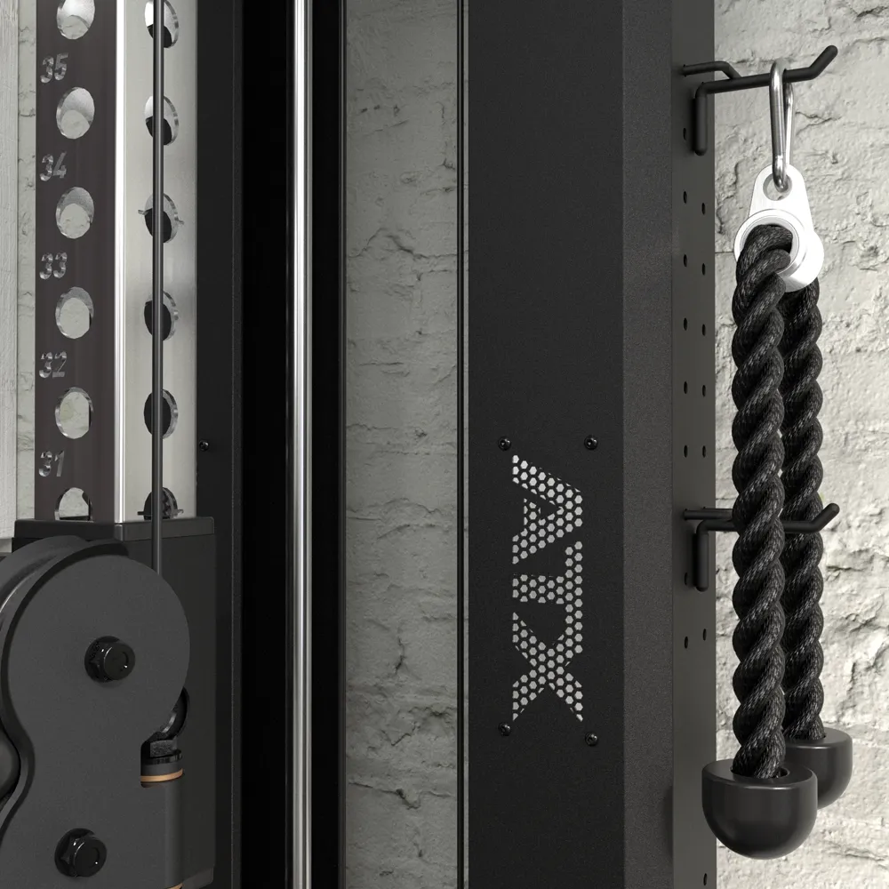 Close-up of an ATX® Single Cable Station - Wall Mounted (Copy) gym machine with a black rope attachment on a hook and a textured white brick wall in the background.