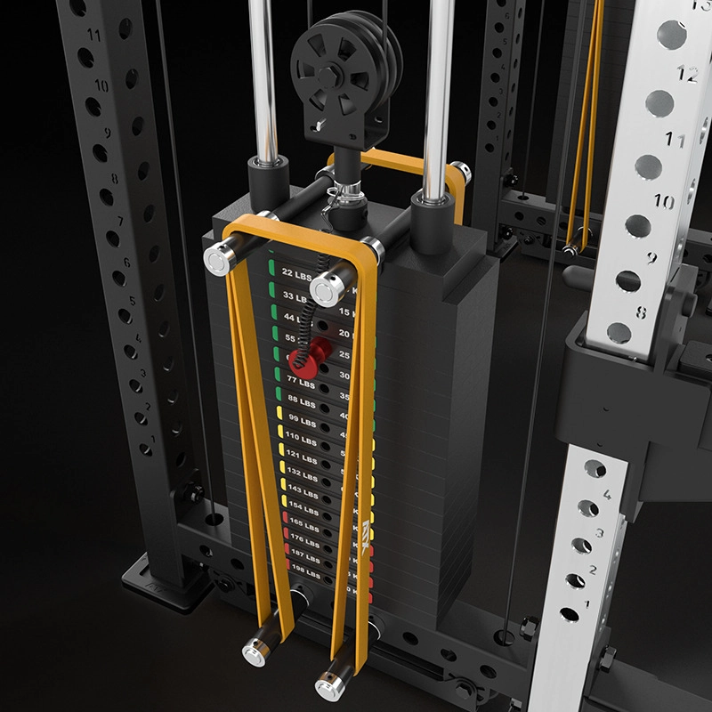 Close-up of a weight stack on a cable machine with yellow guide rods, numbered weight plates, and a pin for selecting the resistance in pounds, attached to a metal frame with measurement markings.