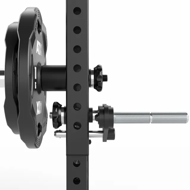 A close-up side view of a barbell loaded with weight plates, mounted on a squat rack with adjustable holes and safety locks, against a plain white background.