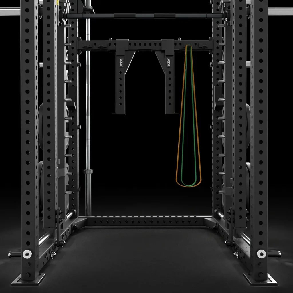 A black metal power rack with multiple holes for adjusting attachments, featuring two resistance bands, one green and one orange, hanging from a central pull-up bar, all set against a black background.