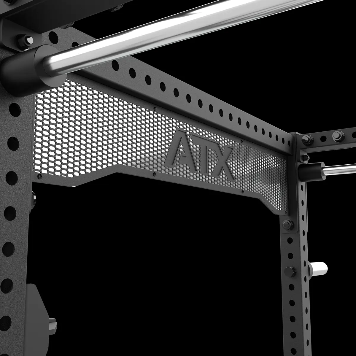 Close-up of a black metal gym rack with a perforated panel featuring the letters ATX cut out, against a black background.