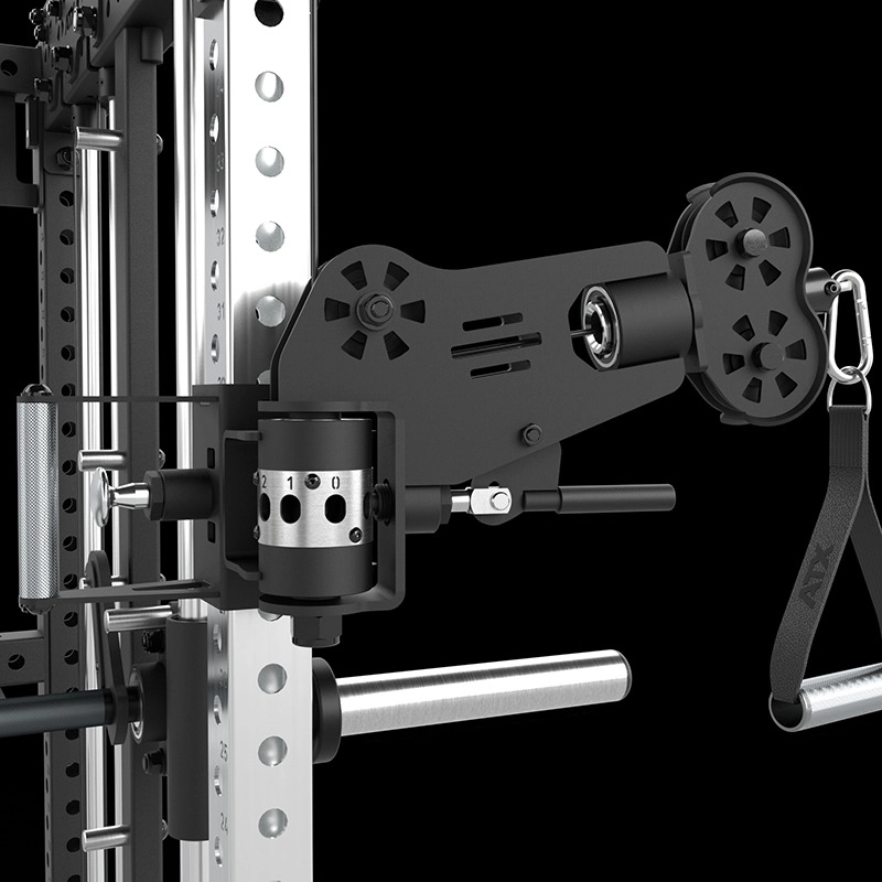 Close-up of a cable machine attachment with pulleys, adjustment knobs, and a strap handle, mounted on a metal frame against a black background.
