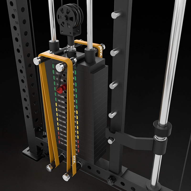 A close-up view of a weight stack on a gym machine, featuring a pin selector and weight increments labeled in red, yellow, and green numbers. Metal rods and a pulley system frame the weight stack.