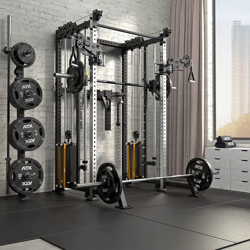 Modern home gym with a weight rack, barbells, weight plates, cable machine, and various attachments on a black mat floor, set against a brick wall with large windows and city buildings visible outside.