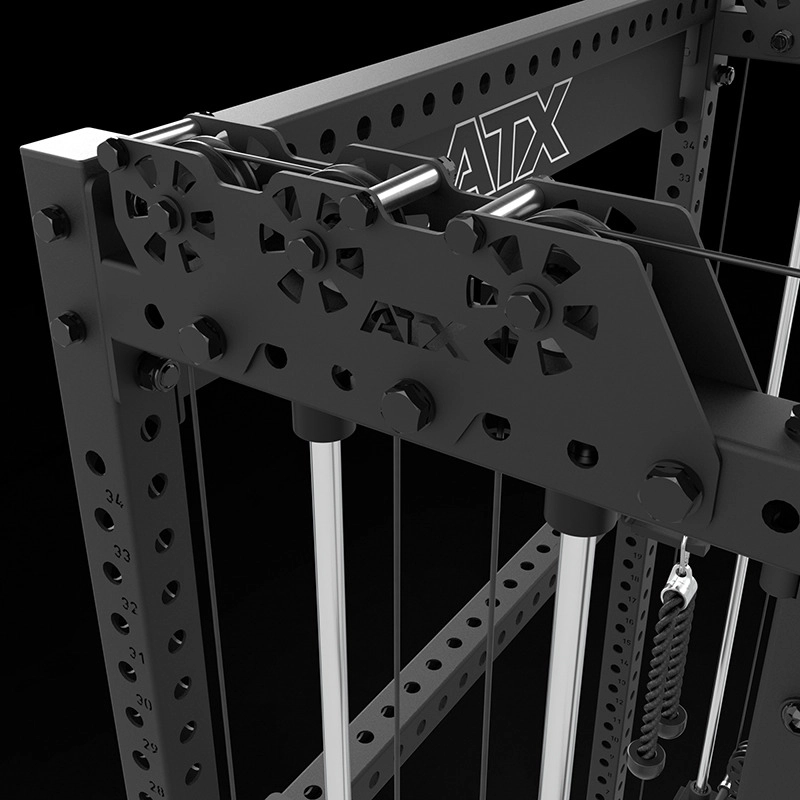 Close-up view of a black ATX fitness cable machine, showing its metal frame, pulleys, cables, and various numbered holes for adjustable settings.