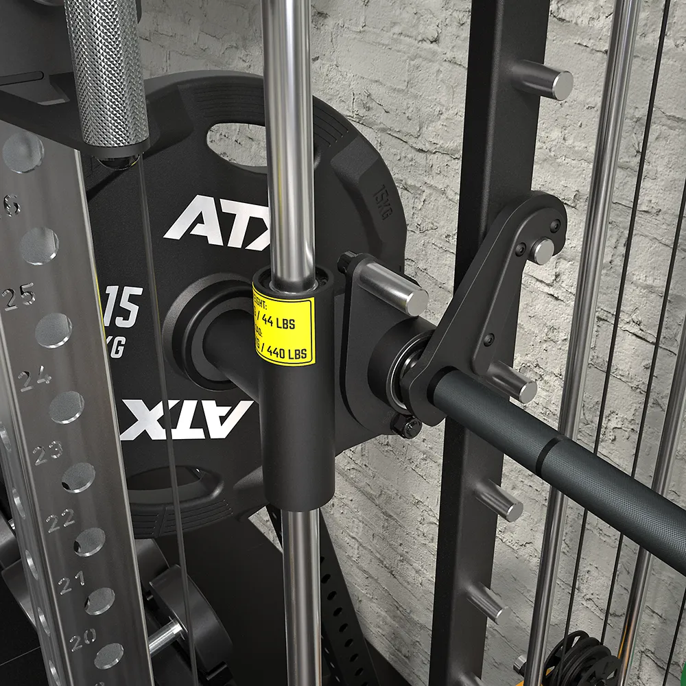 Close-up of the ATX® Squat Rack with Cables (Copy) featuring a barbell, ATX 15 KG plates, and a yellow MAX LOAD 200 KG / 440 LBS label, set against a textured brick wall.