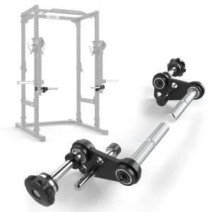 A close-up of a barbell landmine attachment for a squat rack, shown in detail in the foreground and attached to a power rack frame in the background. The attachment is black with silver metal bars and adjustment knobs.