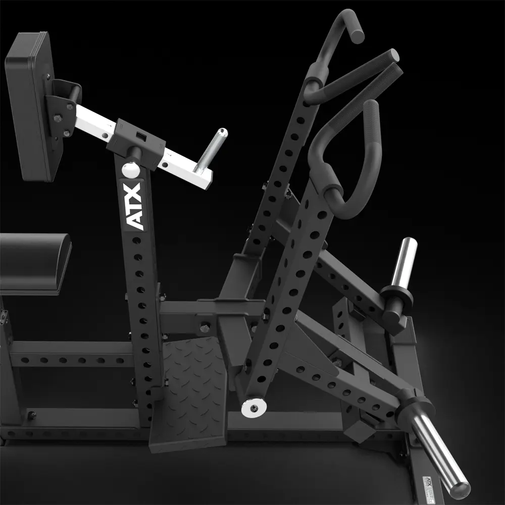 Black ATX gym machine with multiple handles, padded seat, adjustable metal arms, and footplate, designed for strength training exercises, set against a black background.