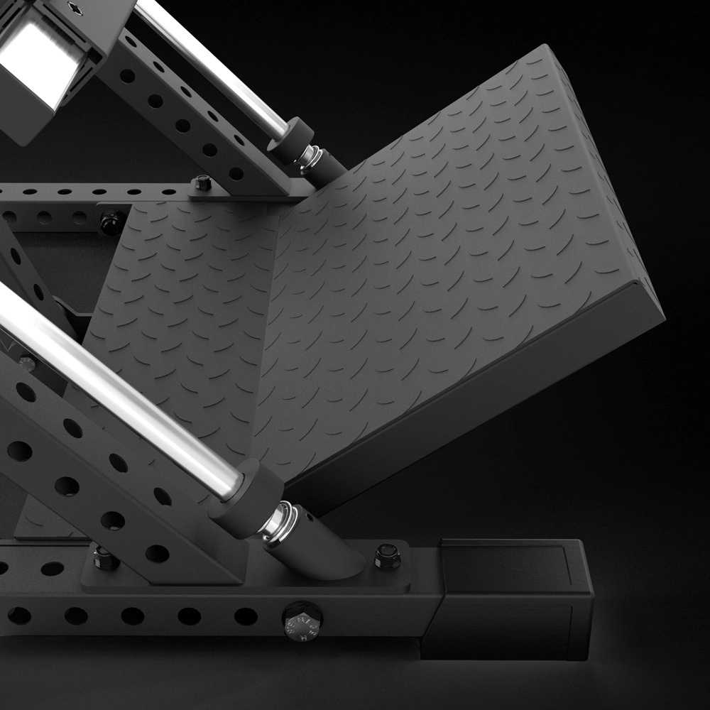Close-up of a black metal leg press machine with a textured, angled footplate and sturdy frame, featuring bolts and cylindrical rods against a dark background.