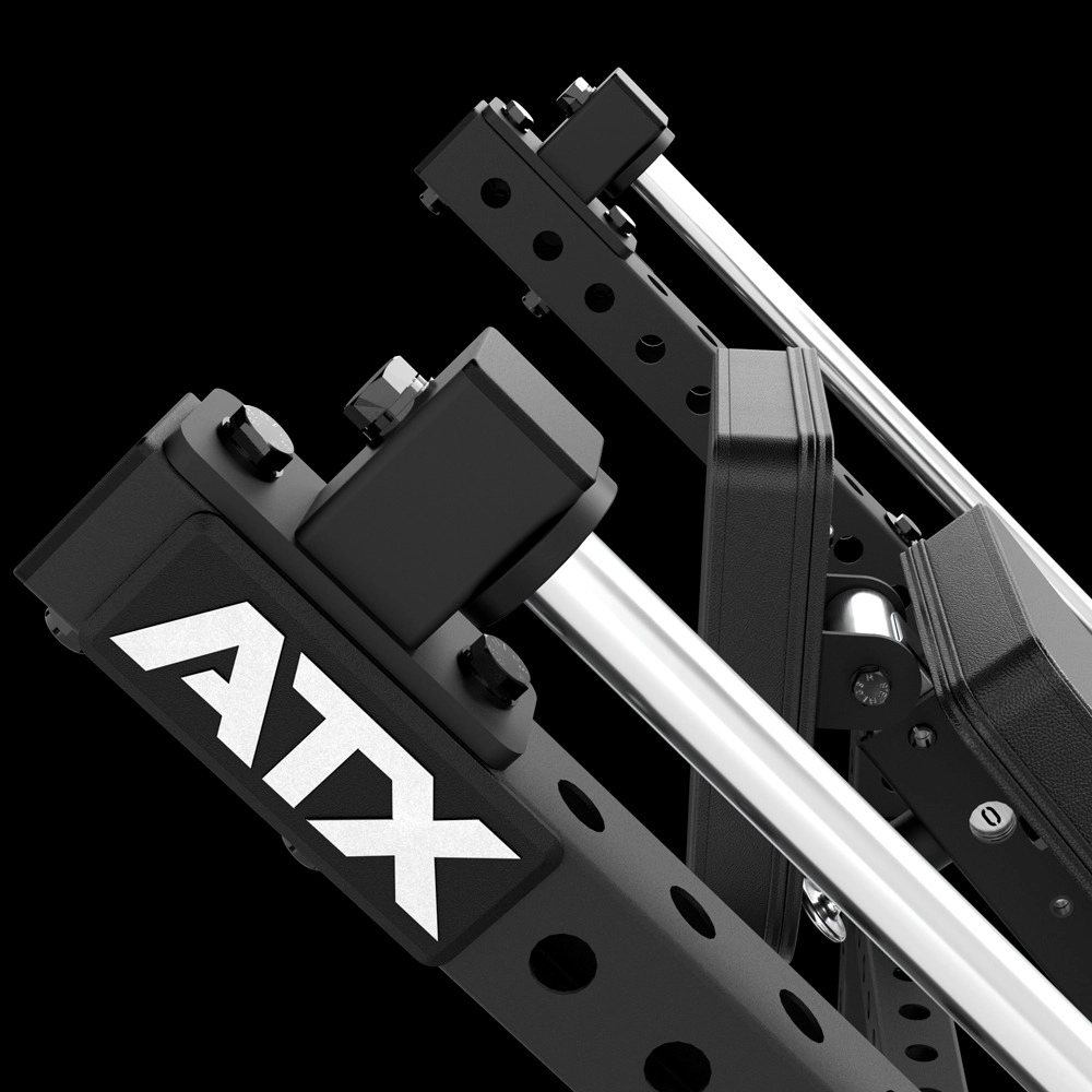Close-up of a black metal ATX-branded fitness or gym equipment frame with adjustable holes and chrome rods, set against a black background.
