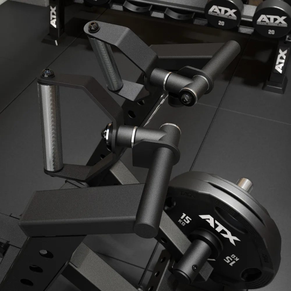 Close-up of a black gym machine with adjustable handles and loaded weight plates labeled “ATX” in a fitness center. Dumbbells are visible in the background.