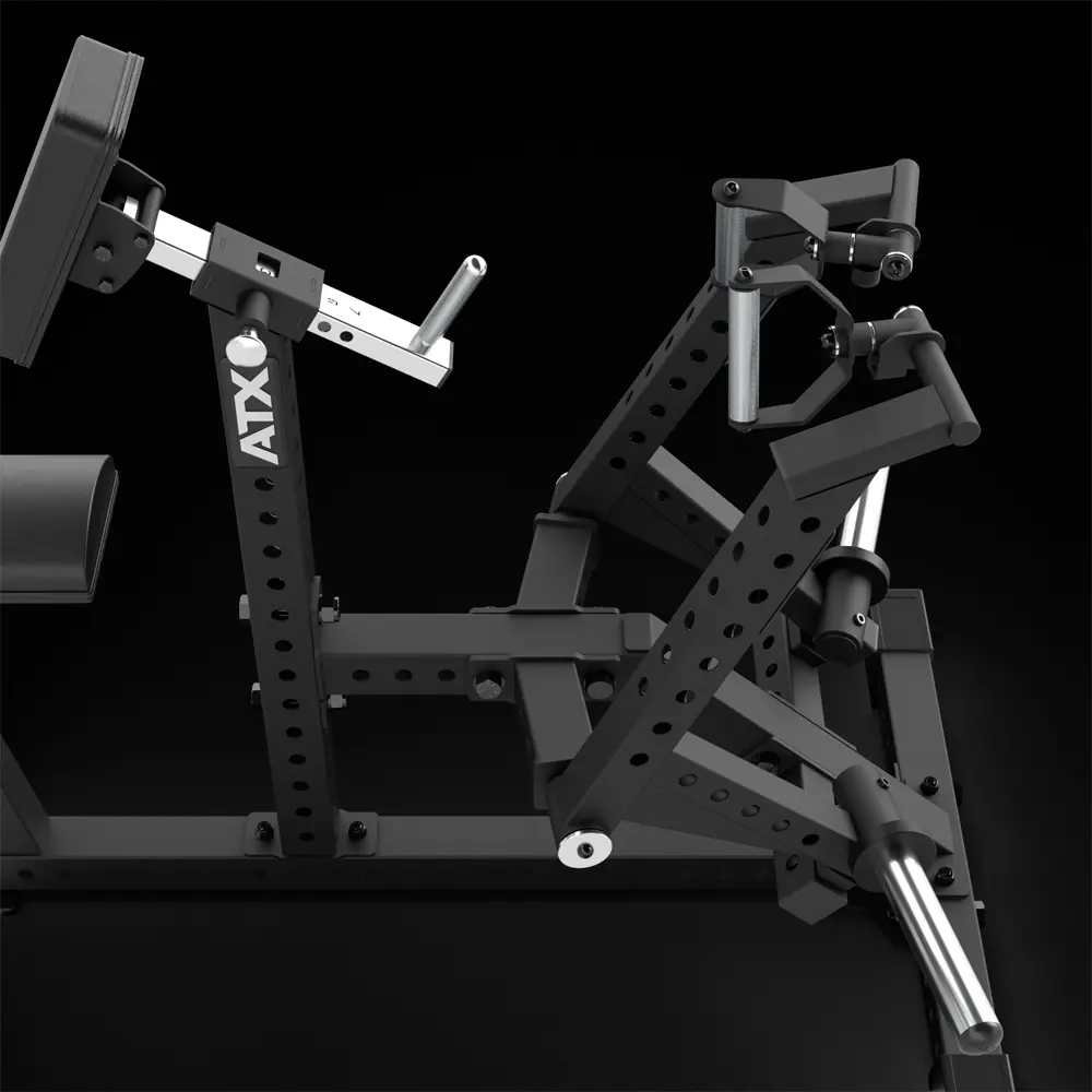 A black ATX gym machine with adjustable handles, padded supports, weight plate holders, and multiple holes for pin adjustment, designed for strength training exercises.