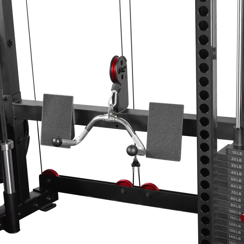 Close-up of a gym cable machine with a seated row attachment, weight stack on the right marked in pounds, and black and red pulleys. Two padded supports are visible behind the handle.