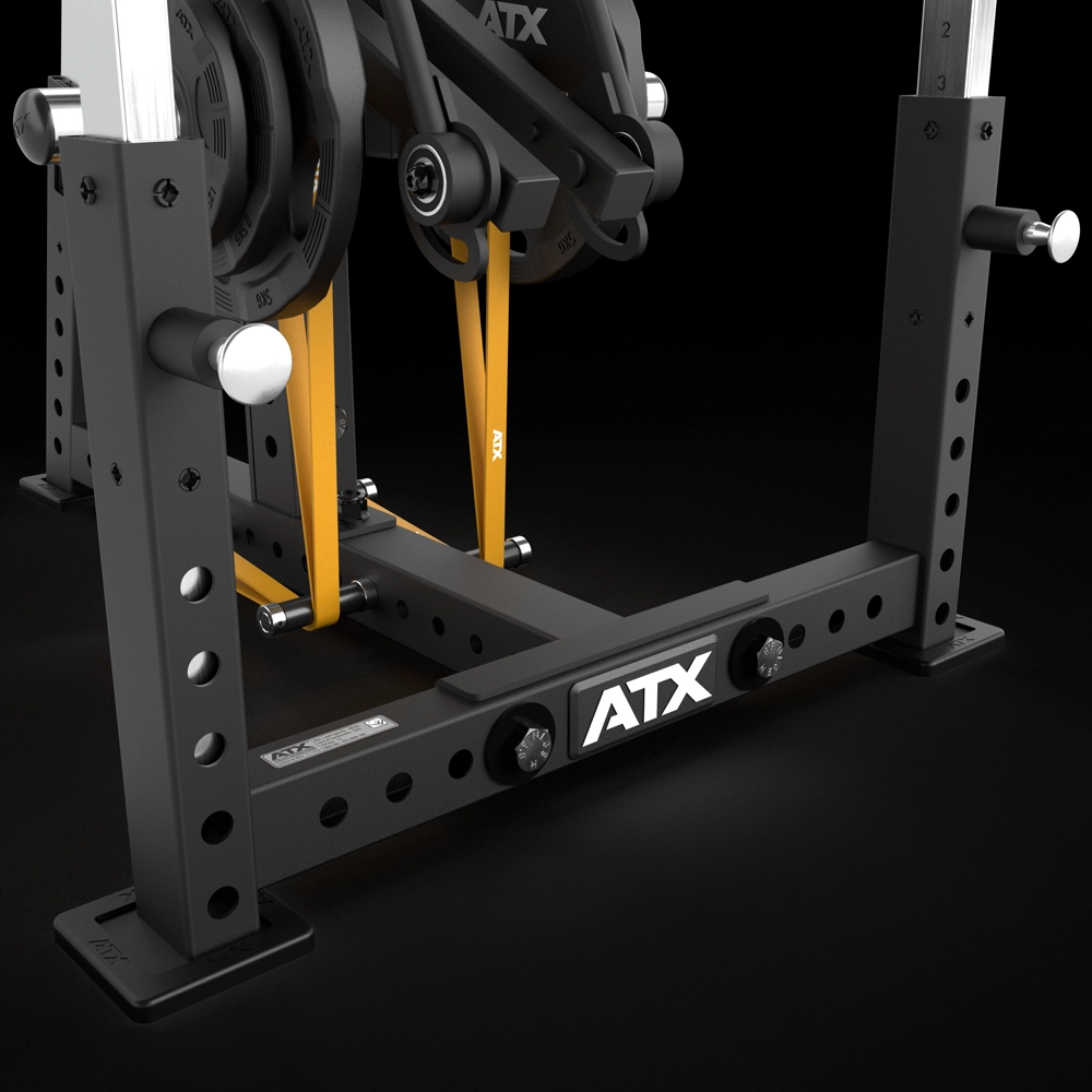 Close-up of the ATX® Bicep Blaster Preacher Curl Machine (Copy) base featuring multiple holes, weight plates, resistance bands, and sturdy metal supports—ideal for strength training and focused biceps workouts.
