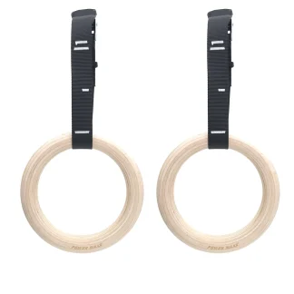 A pair of wooden gymnastic rings with black adjustable straps, laid out against a white background.