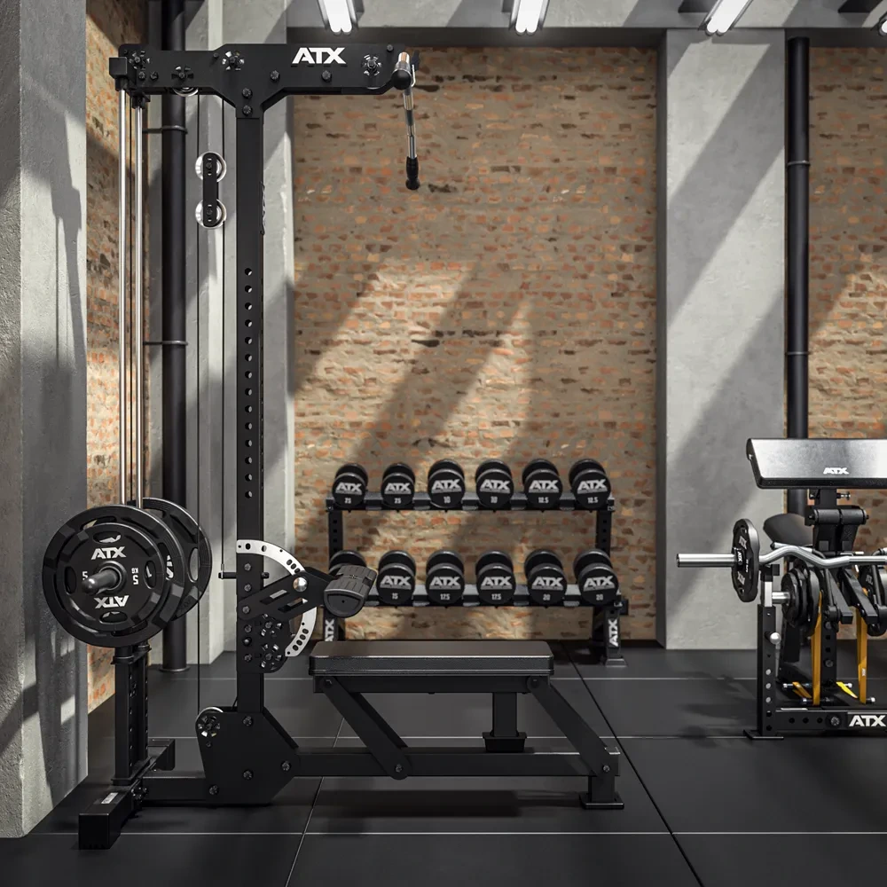 A gym with a cable machine, weight plates, dumbbells on a rack, and a bench press, all in a modern industrial-style room with brick walls and black flooring.