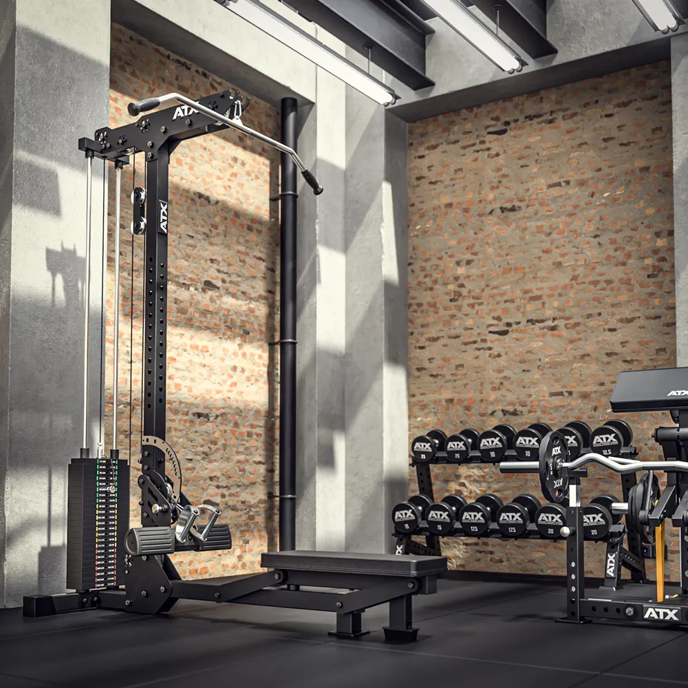 A modern gym with brick walls, featuring a cable machine, a flat bench, a rack of dumbbells, and additional gym equipment. Natural and artificial lights illuminate the clean, organized space.