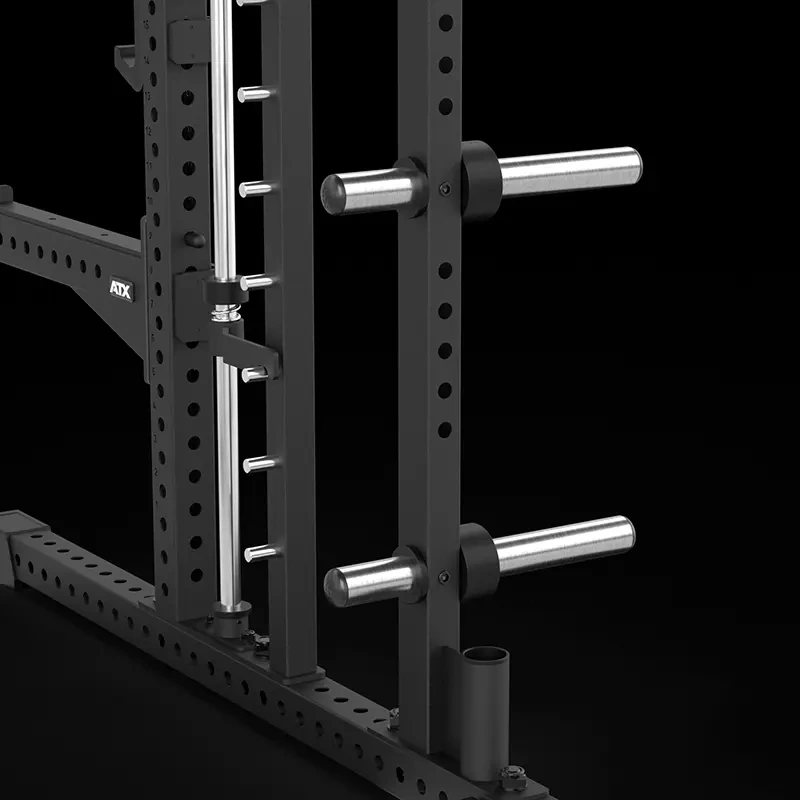 Close-up of the barbell storage holders and accessory storage tube on the ATX® Commercial Smith Machine front upright.