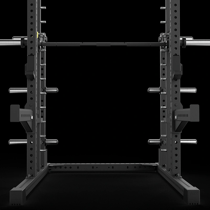 The ATX® Commercial Smith Machine MPX-780 shown as a full black steel unit with J-hooks, weight posts and barbell mounted at the top rail.