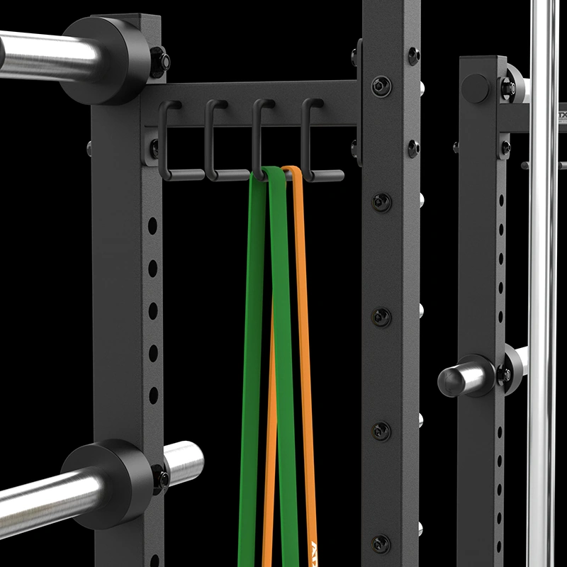 Close-up of integrated storage hooks holding resistance bands on the ATX® Commercial Smith Machine frame.