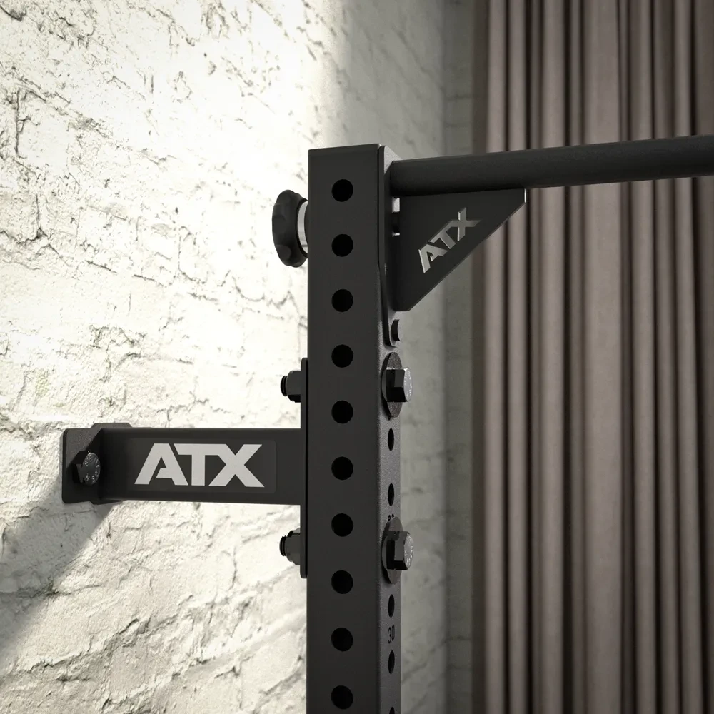 Wall-mounted ATX pull-up rig with a black steel frame and a horizontal bar.