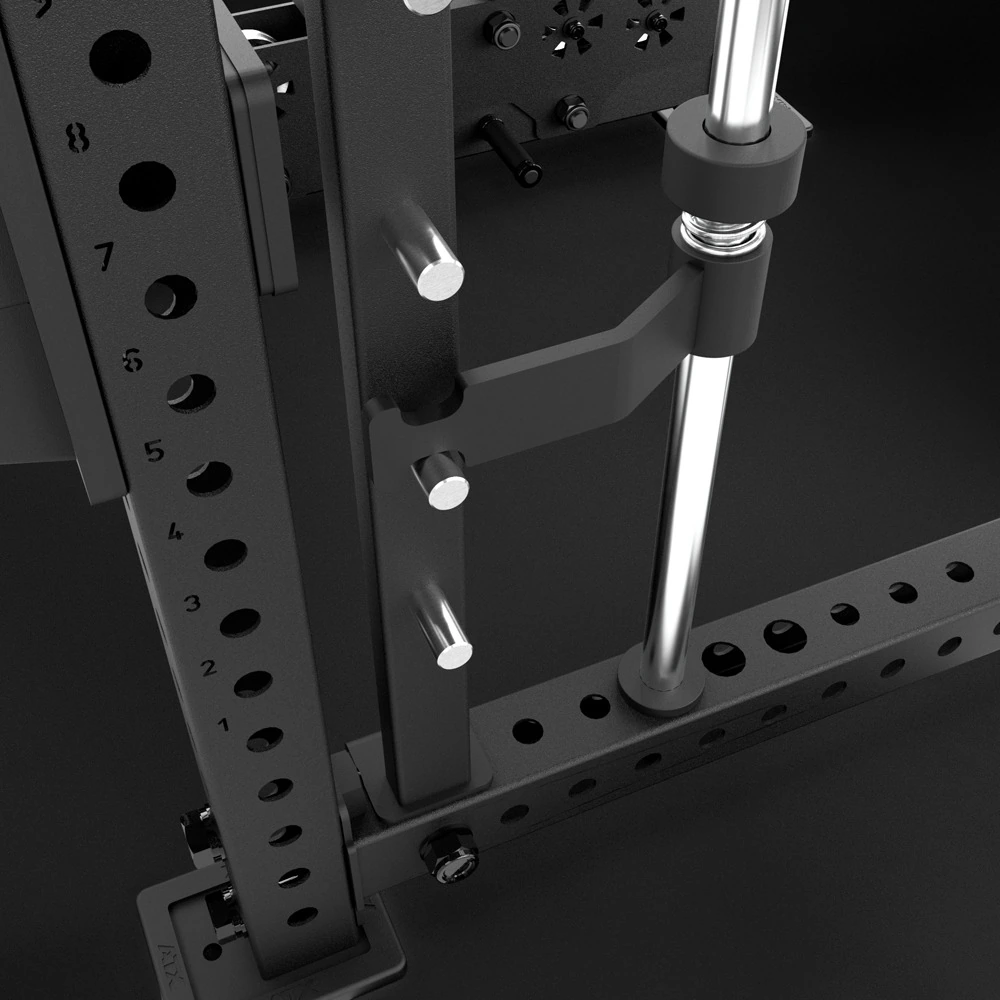 Close-up of the adjustable spring-buffered safety catch on the ATX® Multipress Option guide rail, next to the laser-numbered upright.